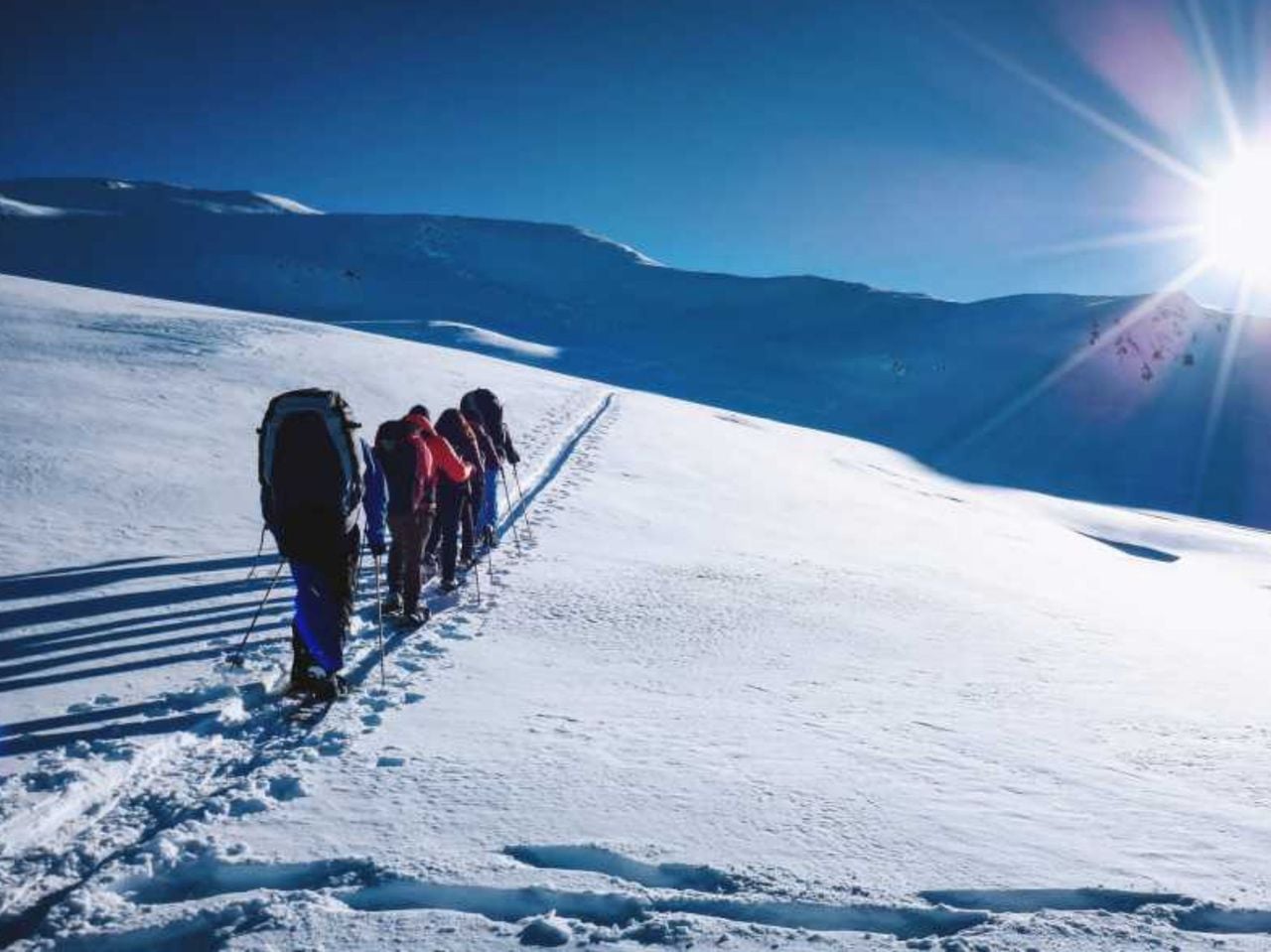 Snowshoeing and paragliding in Davos