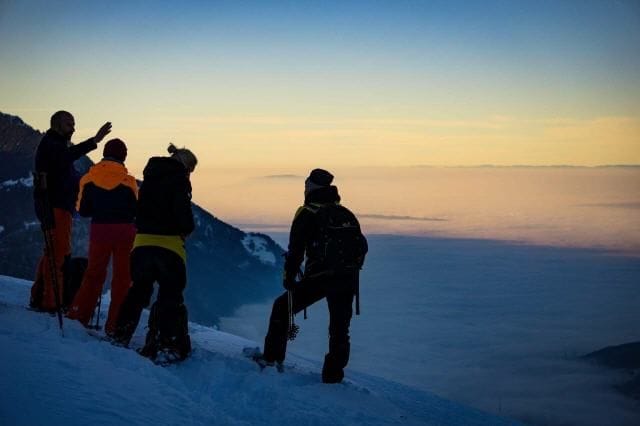Snowshoe tour and sledding with fondue in Davos