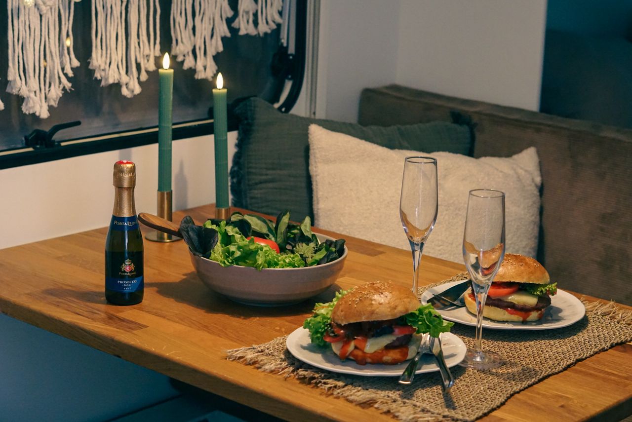 Romantic burger dinner in the caravan