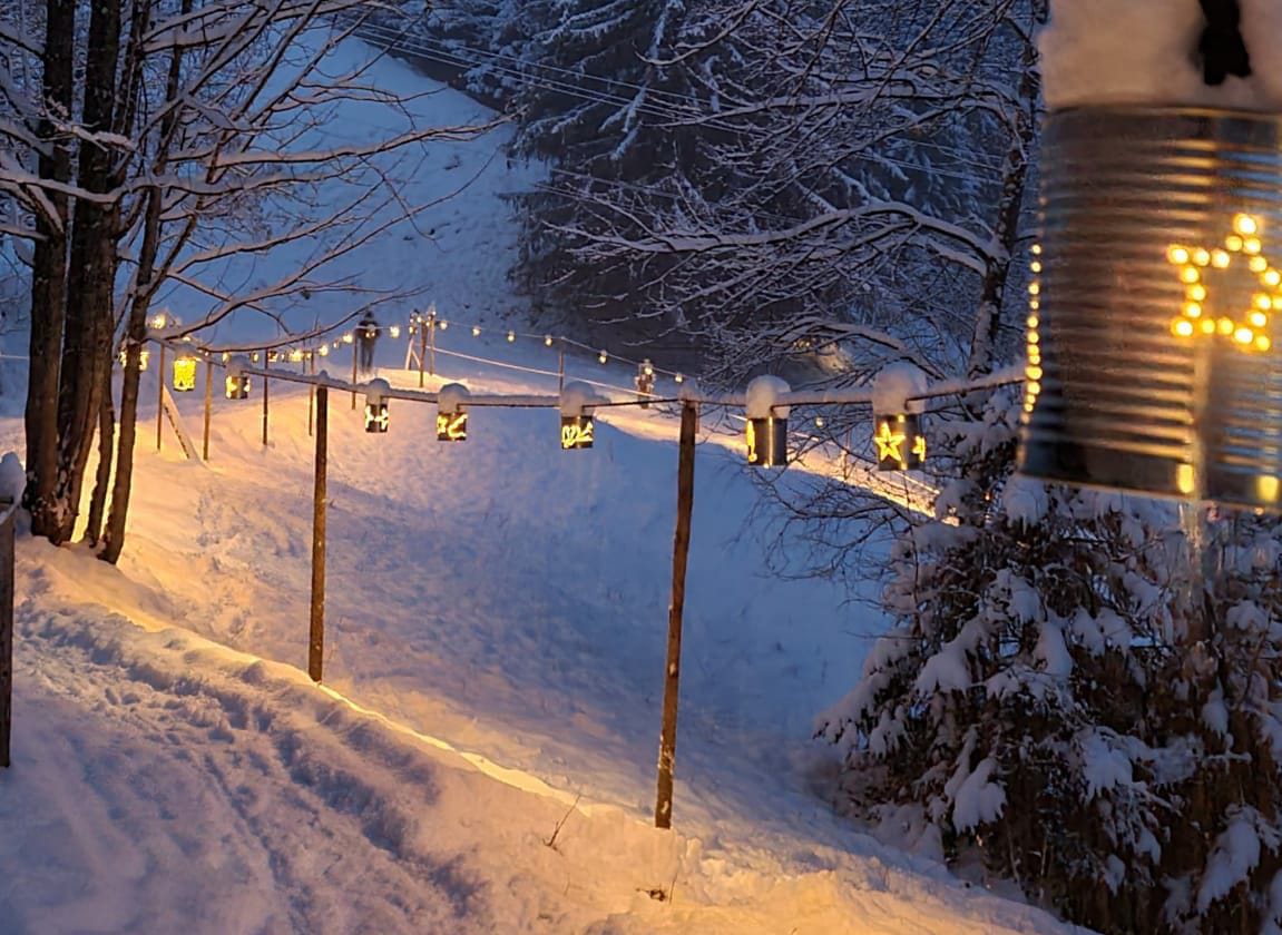 Illuminated tin can trail on the Grimmialp